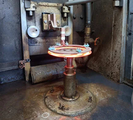Image of a vertical induction heating arrangement manufactured by Induction Annealing Machine Manufacturers in India